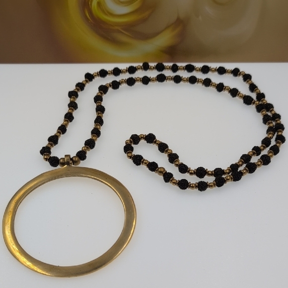 Nataraj Elegant Gold and Black Necklace with Circular Pendant - Picture 1 of 6